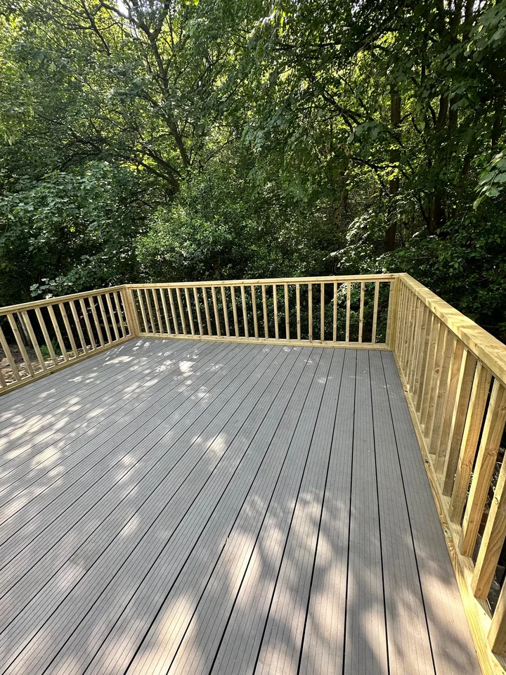 Raised composite deck among trees