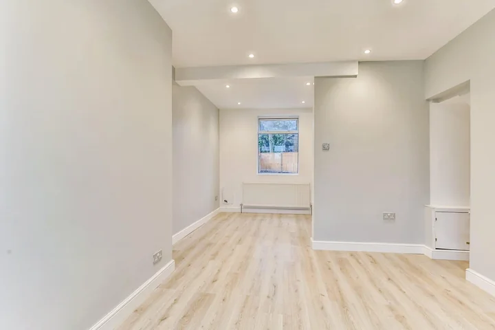 Bright renovated living space with new flooring
